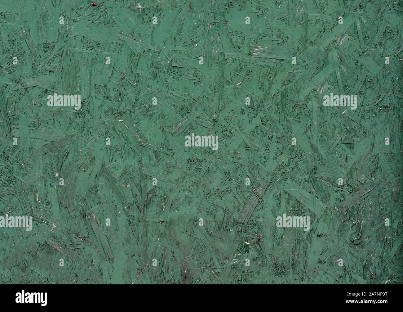 Recycled compressed green painted wood chipboard. Pressed Wooden Panel