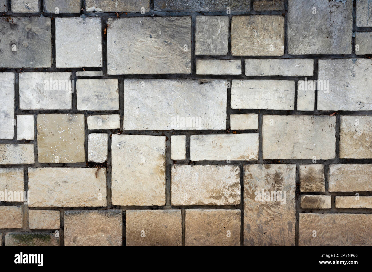 Full frame shot of old stone wall with square and rectangle stones with