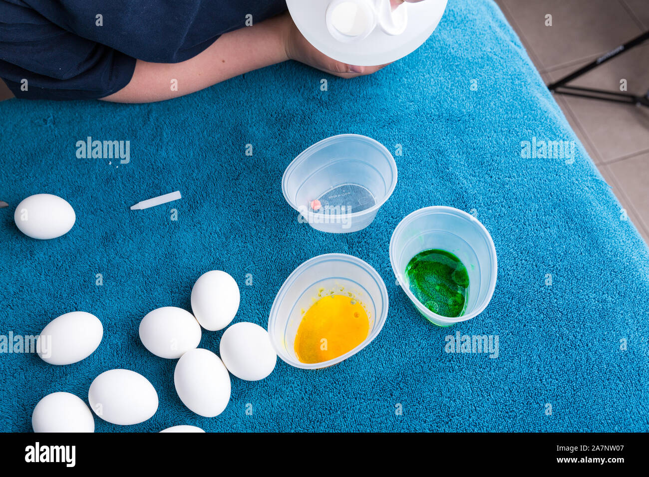 Pouring vinegar into tubs for easter egg dyeing Stock Photo Alamy