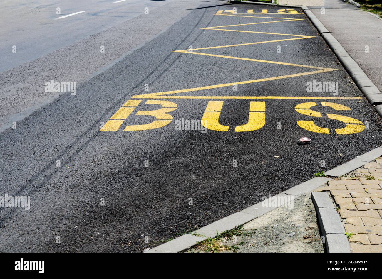 Yellow bus stop road marking Stock Photo Alamy