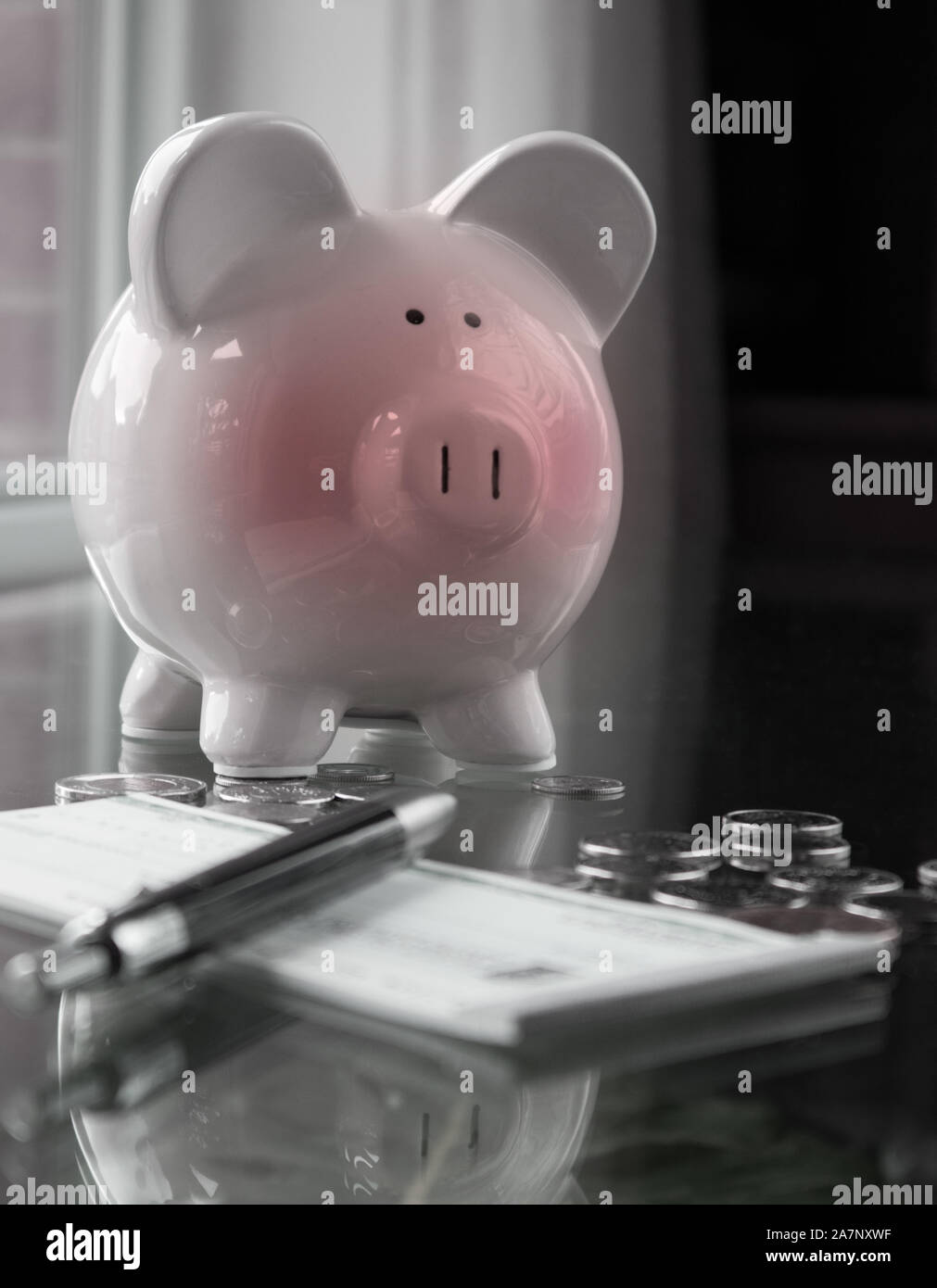 Piggy bank, totally embarrassed after giving his meager savings to his owner .. Stock Photo