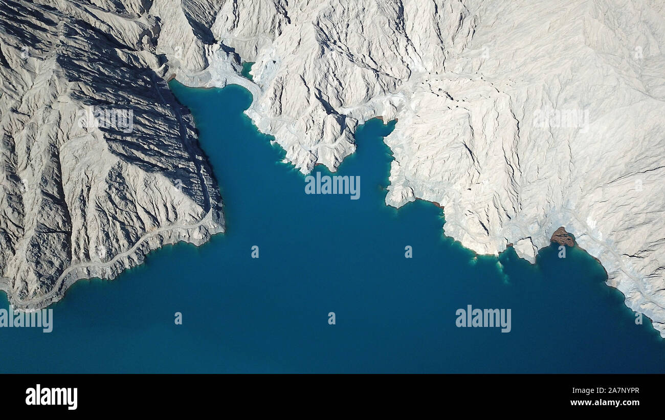 An aerial view of Milan River Reservoir, which was constructed in 2011 and is capable of generating over 10 million kWh annually, resembling a mountai Stock Photo