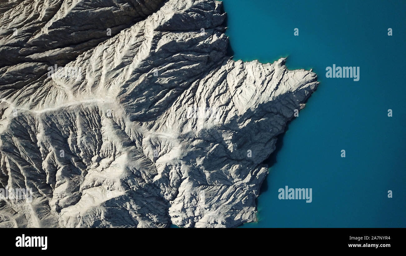 An aerial view of Milan River Reservoir, which was constructed in 2011 and is capable of generating over 10 million kWh annually, resembling a mountai Stock Photo