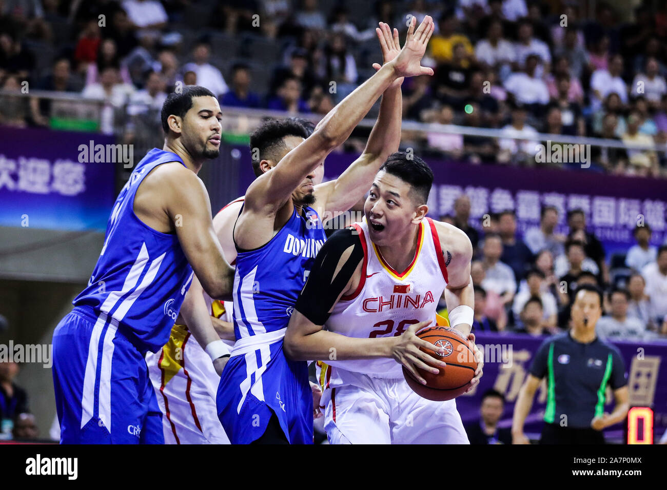 A member of China basketball team, right, keeps the ball during 2019