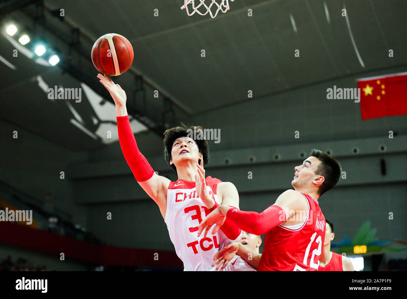 Wang Zhelin, a Chinese professional basketball player, left, jumps for a  layup during 2019 Zhouzhuang Cup Kunshan Men's International Basketball Cham  Stock Photo - Alamy
