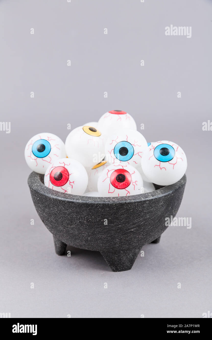 Spooky plastic multicolored eye  pieces in a bowl Stock Photo