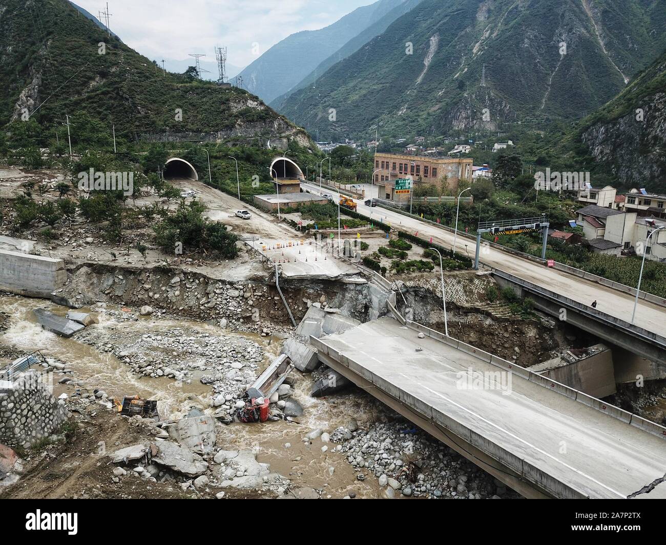 Aerial view of collapsed viaduct and overturned truck due to mudslide in Wenchuan county, Aba Prefecture, southwest China's Sichuan province, 20 Augus Stock Photo
