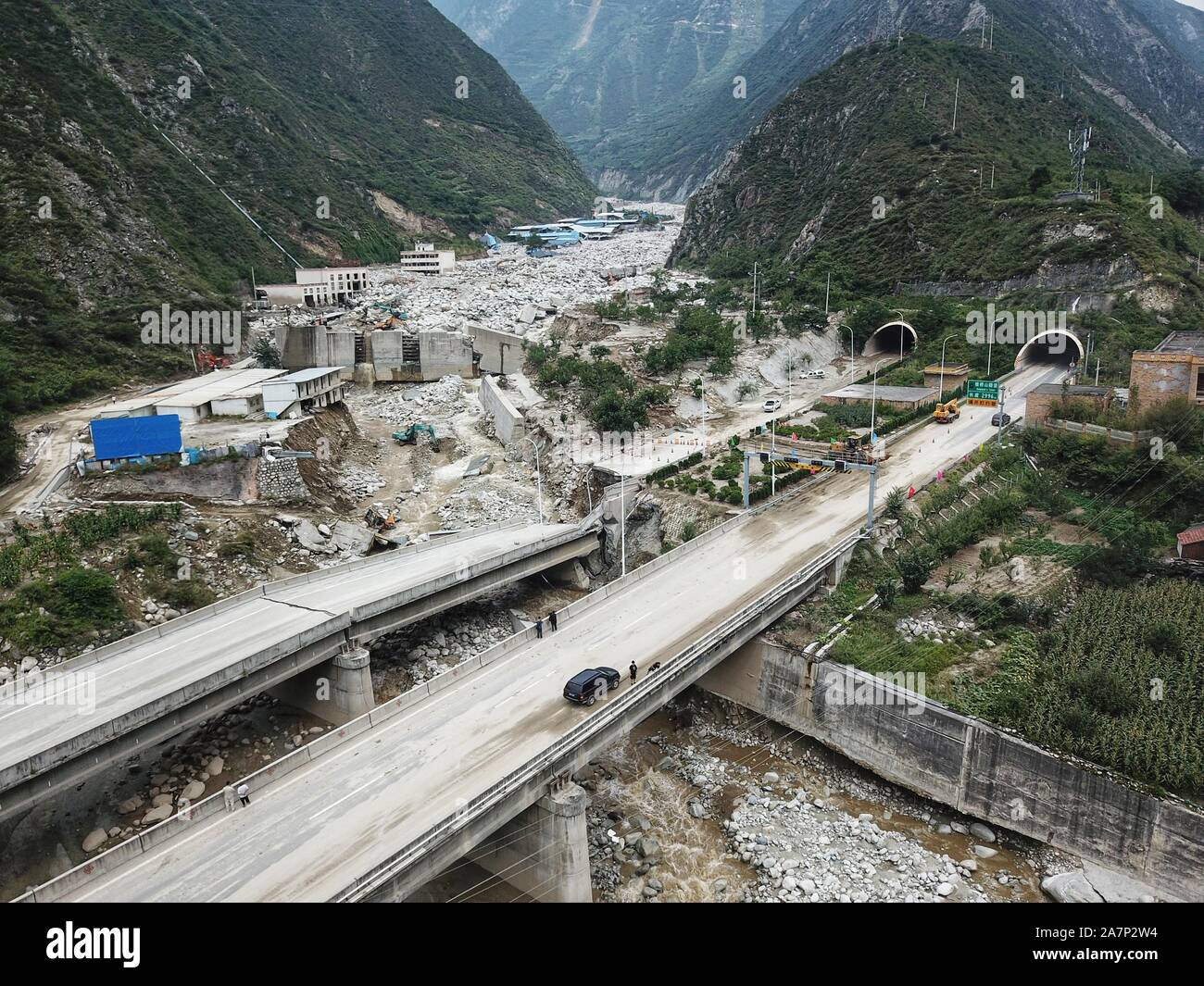 Aerial view of collapsed viaduct and overturned truck due to mudslide in Wenchuan county, Aba Prefecture, southwest China's Sichuan province, 20 Augus Stock Photo