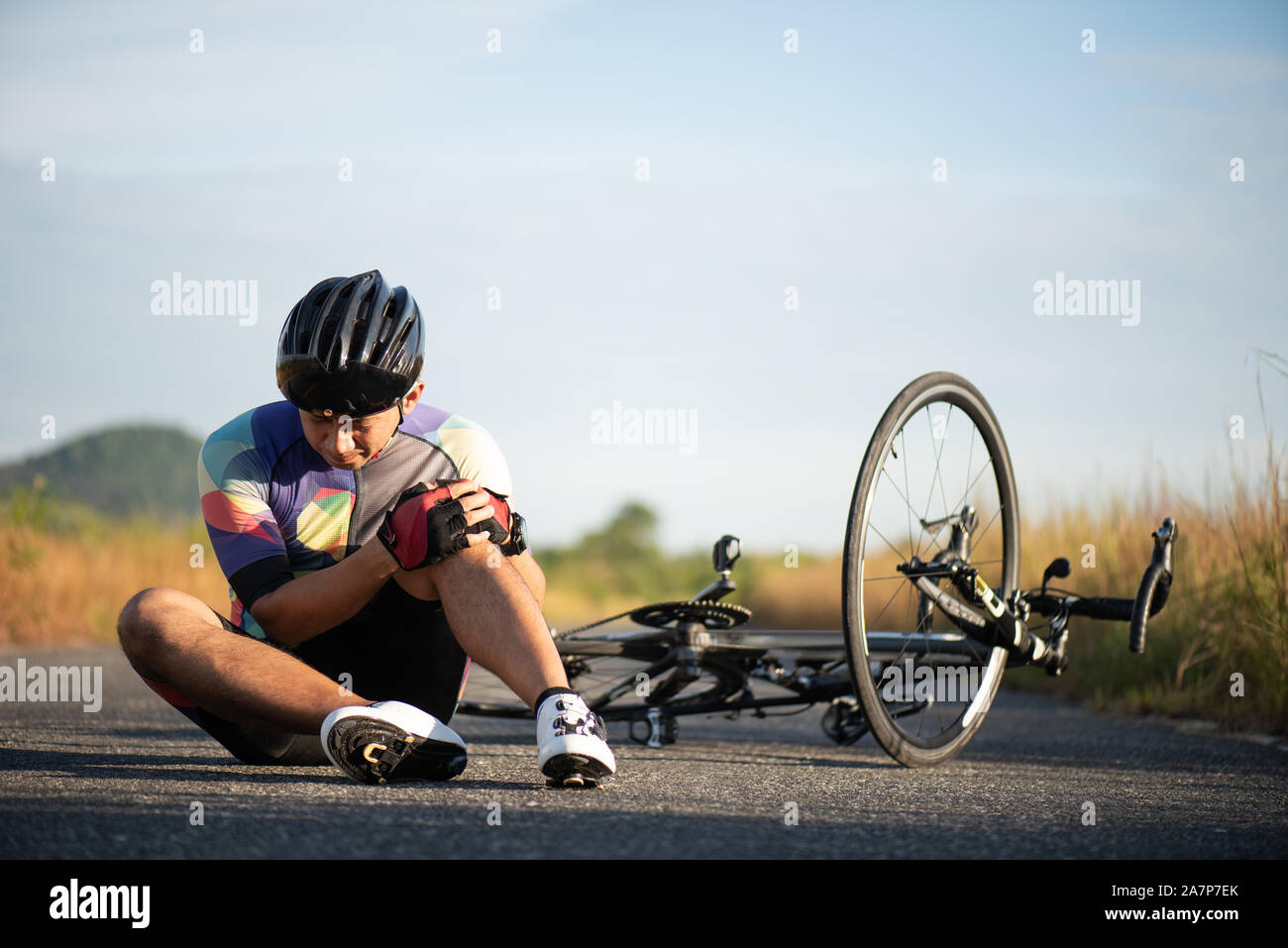Bike injuries. Man cyclist fell fell off road bike while cycling ...