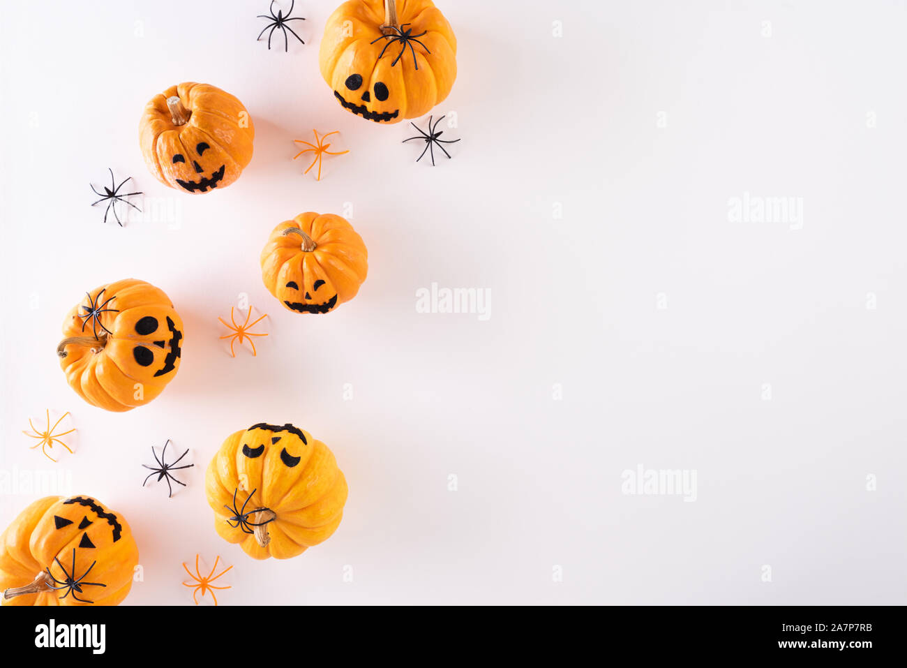 Top view of Halloween crafts, orange pumpkin, ghost, bat and spider on ...