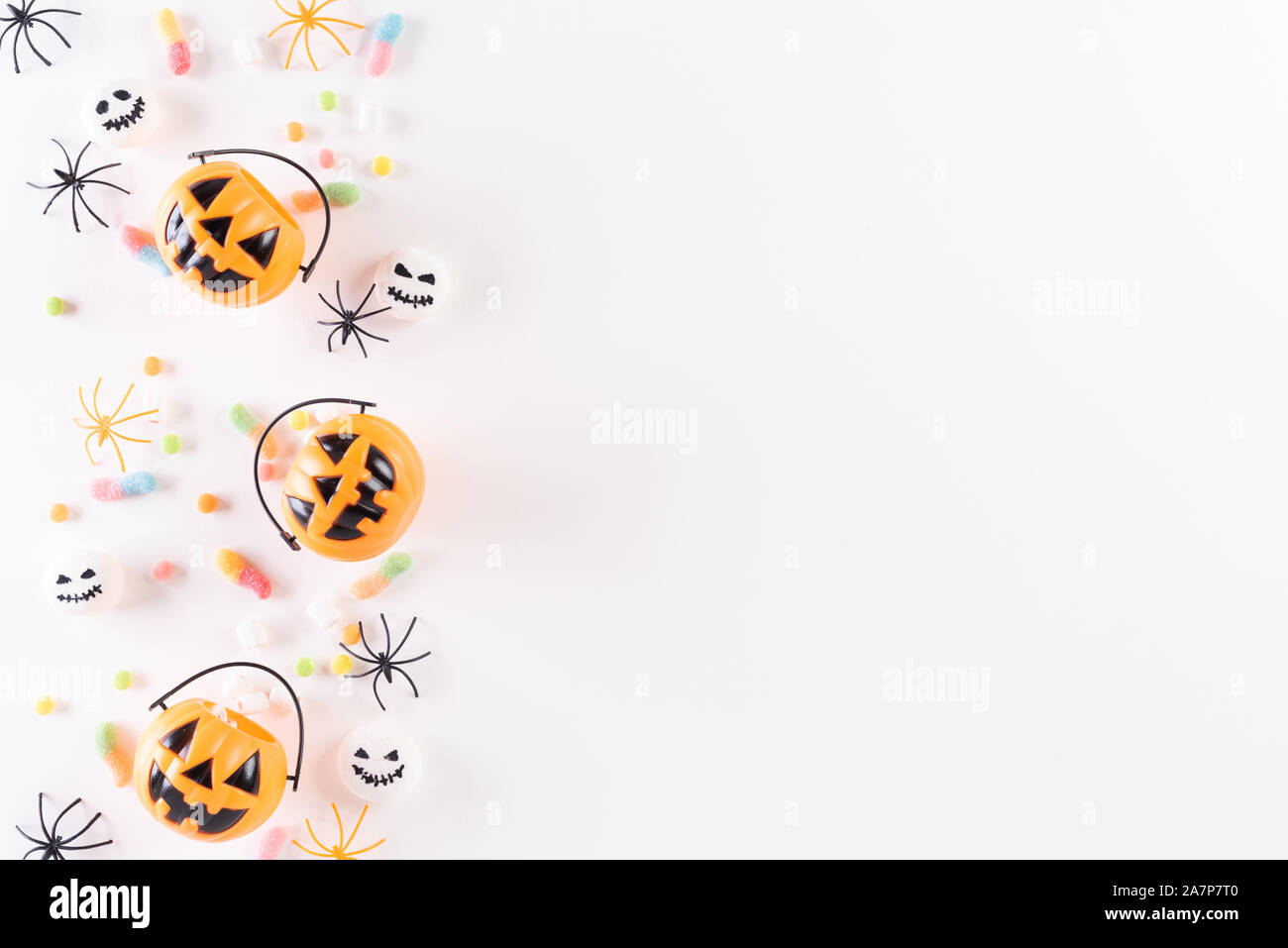 Top view of Halloween crafts, orange pumpkin, ghost, bat and spider on ...
