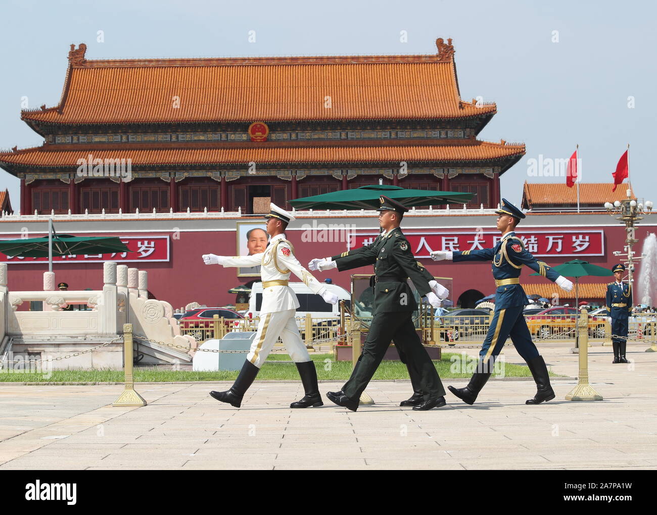 A soldier, a sailor and an airman patrol at the Tian'anmen Square to commemorate the Army Day of 2019, the 92th anniversary of the establishment of Ch Stock Photo