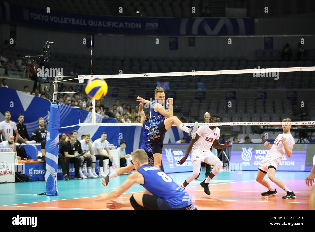 Canada men's national volleyball team celebrate after scoring during