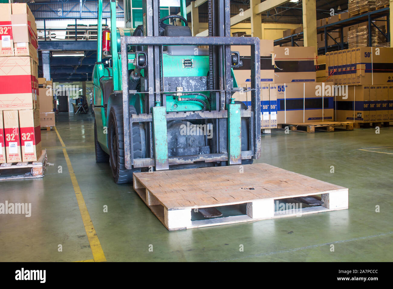 The forklift loading pallet and product cartons Stock Photo