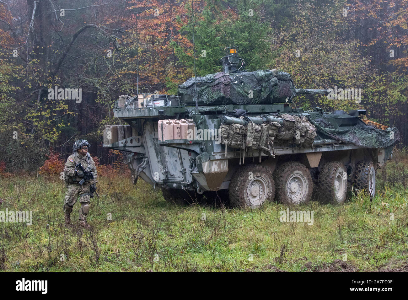 A U.S. Army Soldier assigned to Comanche Troop, 1st Squadron, 2d Cavalry Regiment dismounts from his Stryker Infantry Carrier Vehicle - Dragoon during Dragoon Ready 20 at the Joint Multinational Readiness Center in Hohenfels, Germany, Nov. 3, 2019. Dragoon Ready is a 7th Army Training Command led exercise designed to ensure readiness and certify 2CR Soldiers in NATO combat readiness and unified land operations. (Photo by Spc. Ethan Valetski, 5th Mobile Public Affairs Detachment) Stock Photo