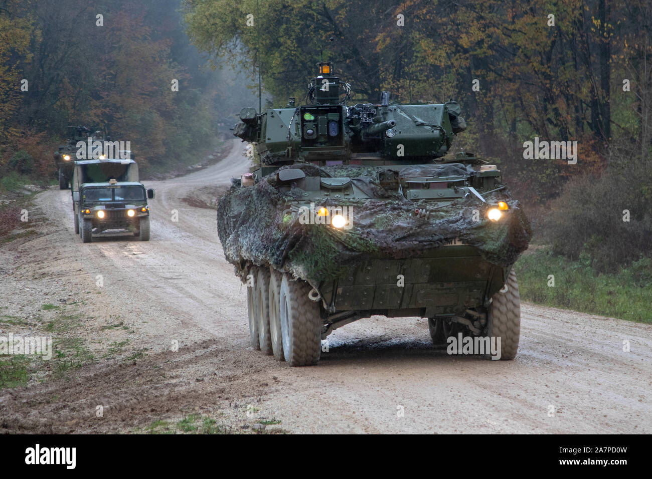 A 30mm Stryker Infantry Carrier Vehicle - Dragoon from Comanche Troop, 1st Squadron, 2d Cavalry Regiment moves to a forward position during Dragoon Ready 20 at the Joint Multinational Readiness Center in Hohenfels, Germany, Nov. 3, 2019. Dragoon Ready is a 7th Army Training Command led exercise designed to ensure readiness and certify 2CR Soldiers in NATO combat readiness and unified land operations. (Photo by Spc. Ethan Valetski, 5th Mobile Public Affairs Detachment) Stock Photo