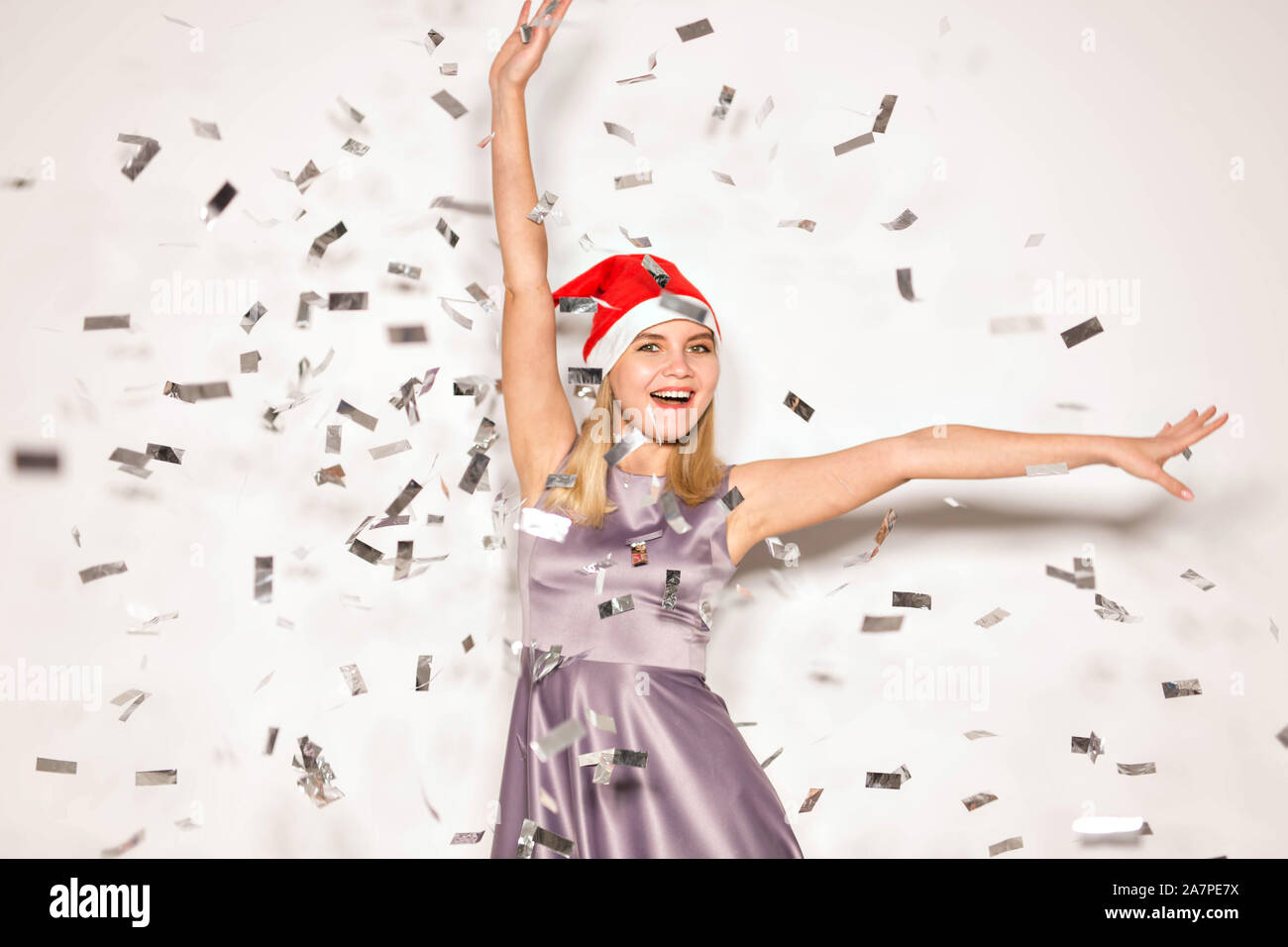New year and holidays concept - Happy excited young woman in santa ...