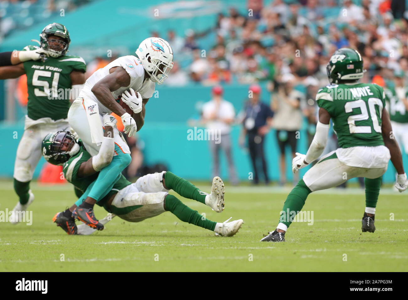 New York Jets running back LaDainian Tomlinson (21) celebrates his game-winning  two-yard touchdown run with Denver Broncos cornerback Nate Jones watching  in the fourth quarter at Invesco Field at Mile High on