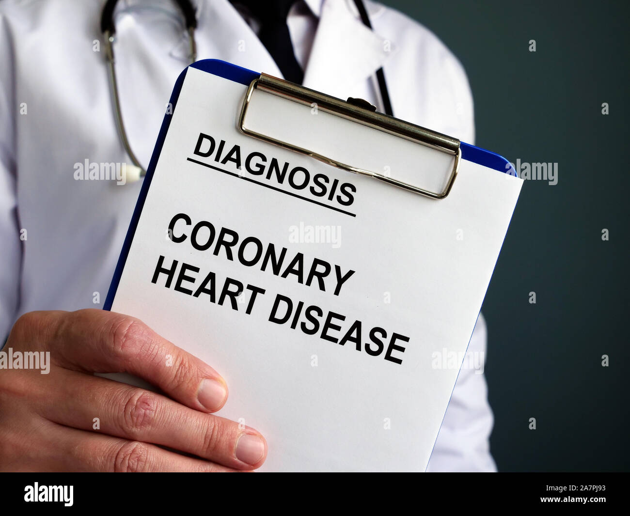 Man holds Coronary heart disease CHD or artery disease CAD diagnosis. Stock Photo