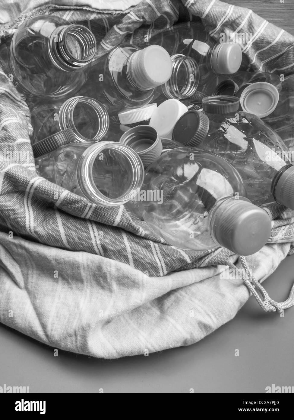 Transparent plastic bottles recycling in eco bag, recycle concept Stock Photo