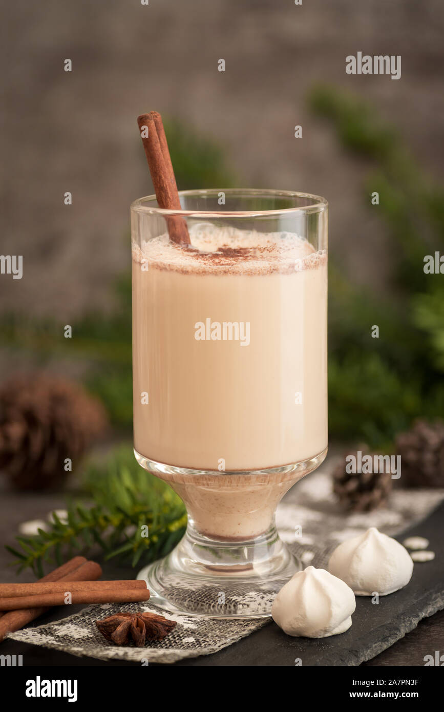 https://c8.alamy.com/comp/2A7PN3F/eggnog-in-glass-cups-with-a-delicate-foam-spices-and-a-cinnamon-stick-2A7PN3F.jpg