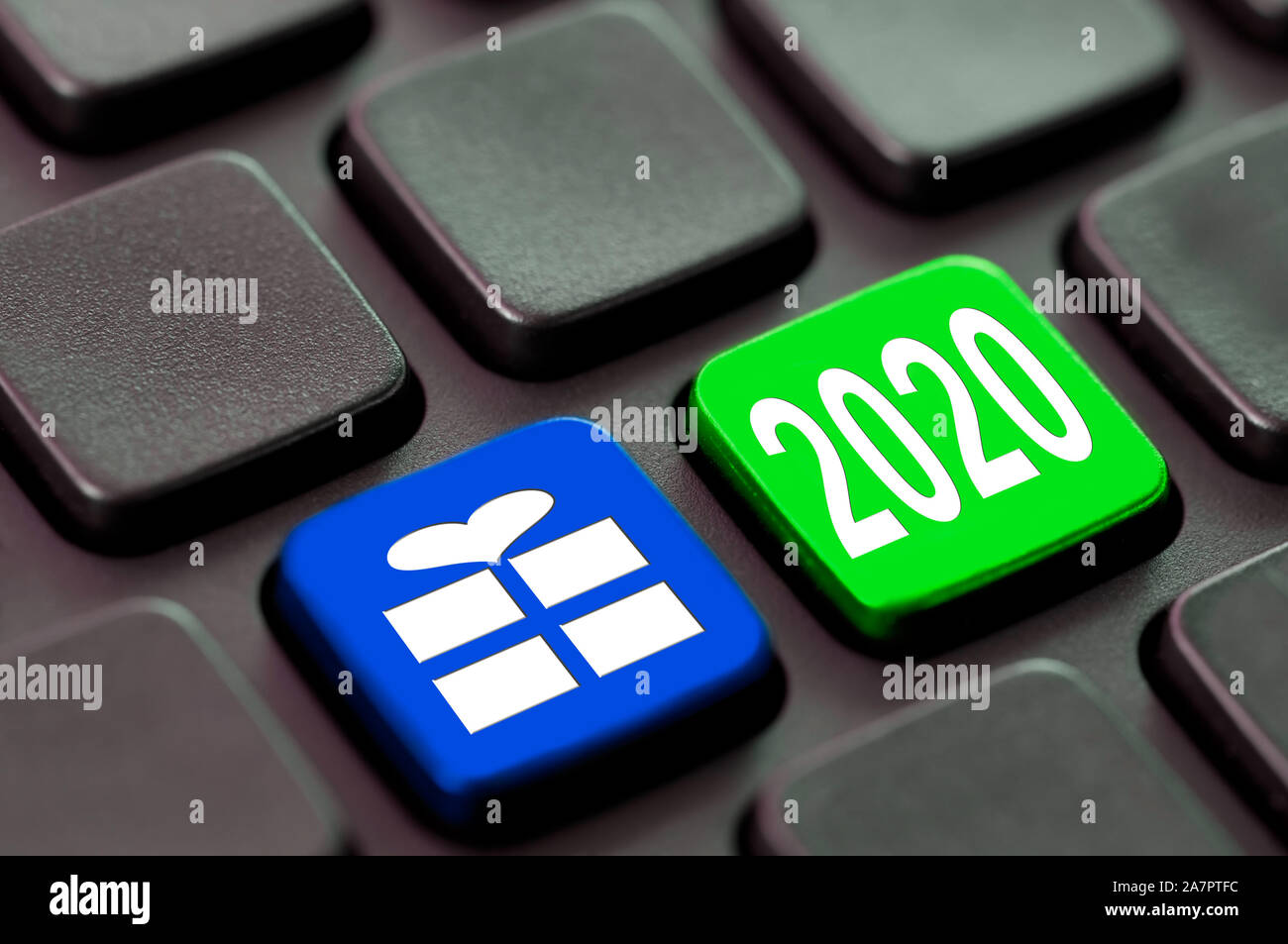 2020 and a gift icon written on a computer keyboard, new year and christmas online shopping concept Stock Photo