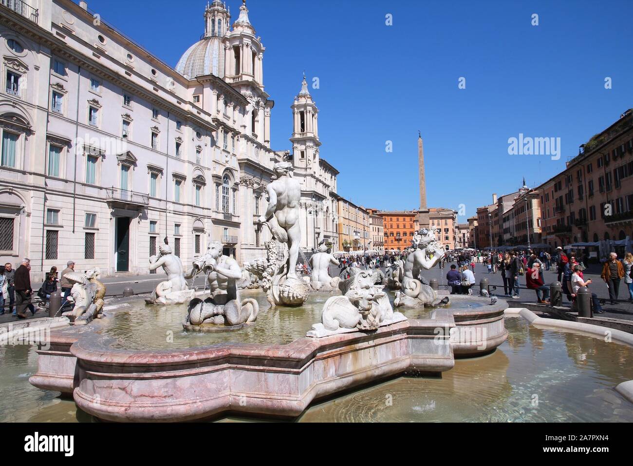 ROME, ITALY - APRIL 10, 2012: Tourists visit Piazza Navona in Rome. According to Euromonitor, Rome is the 3rd most visited city in Europe (5.5m intern Stock Photo