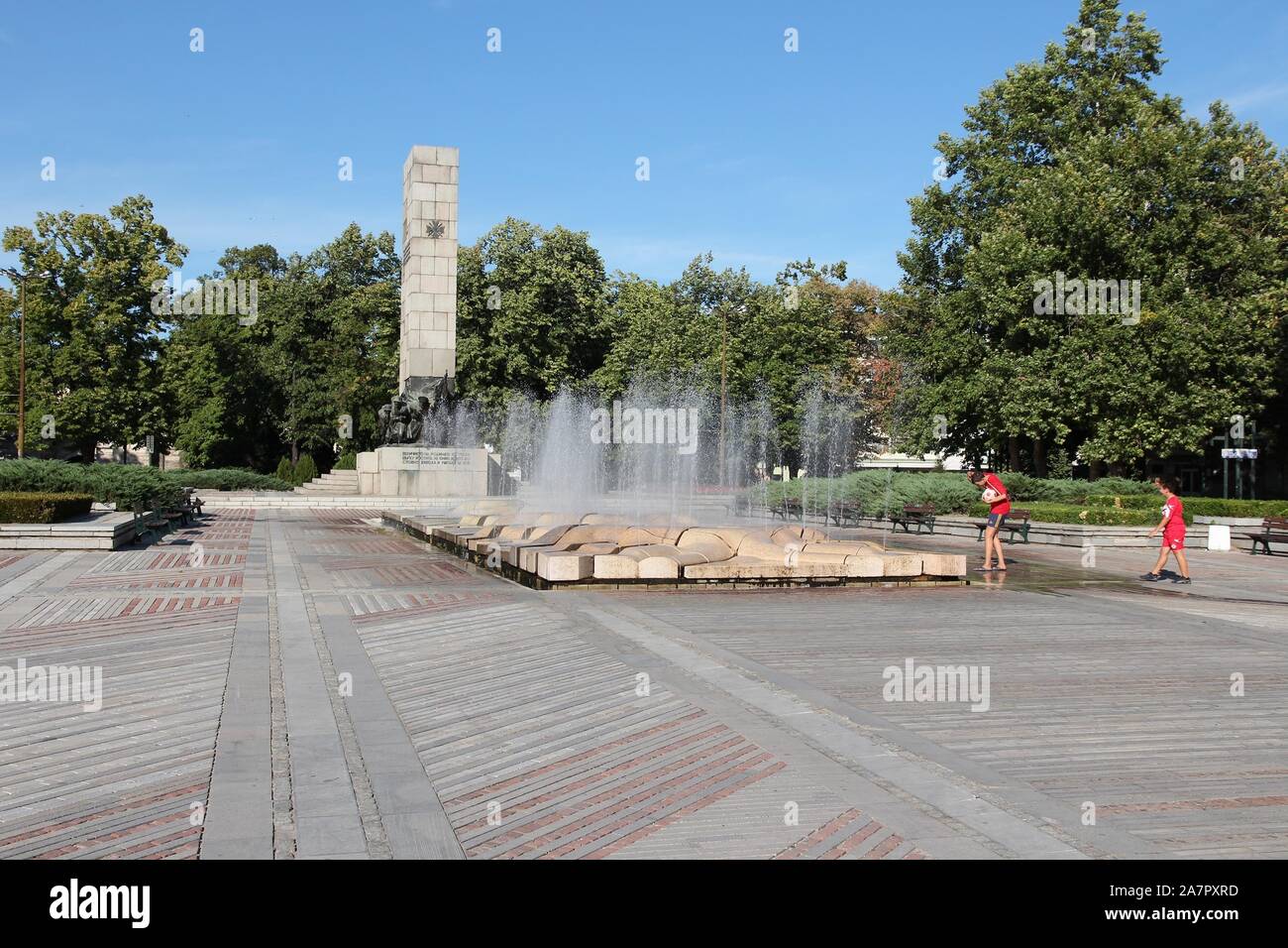 VIDIN, BULGARIA - AUGUST 16, 2012: Boys visit the monument to fallen ...