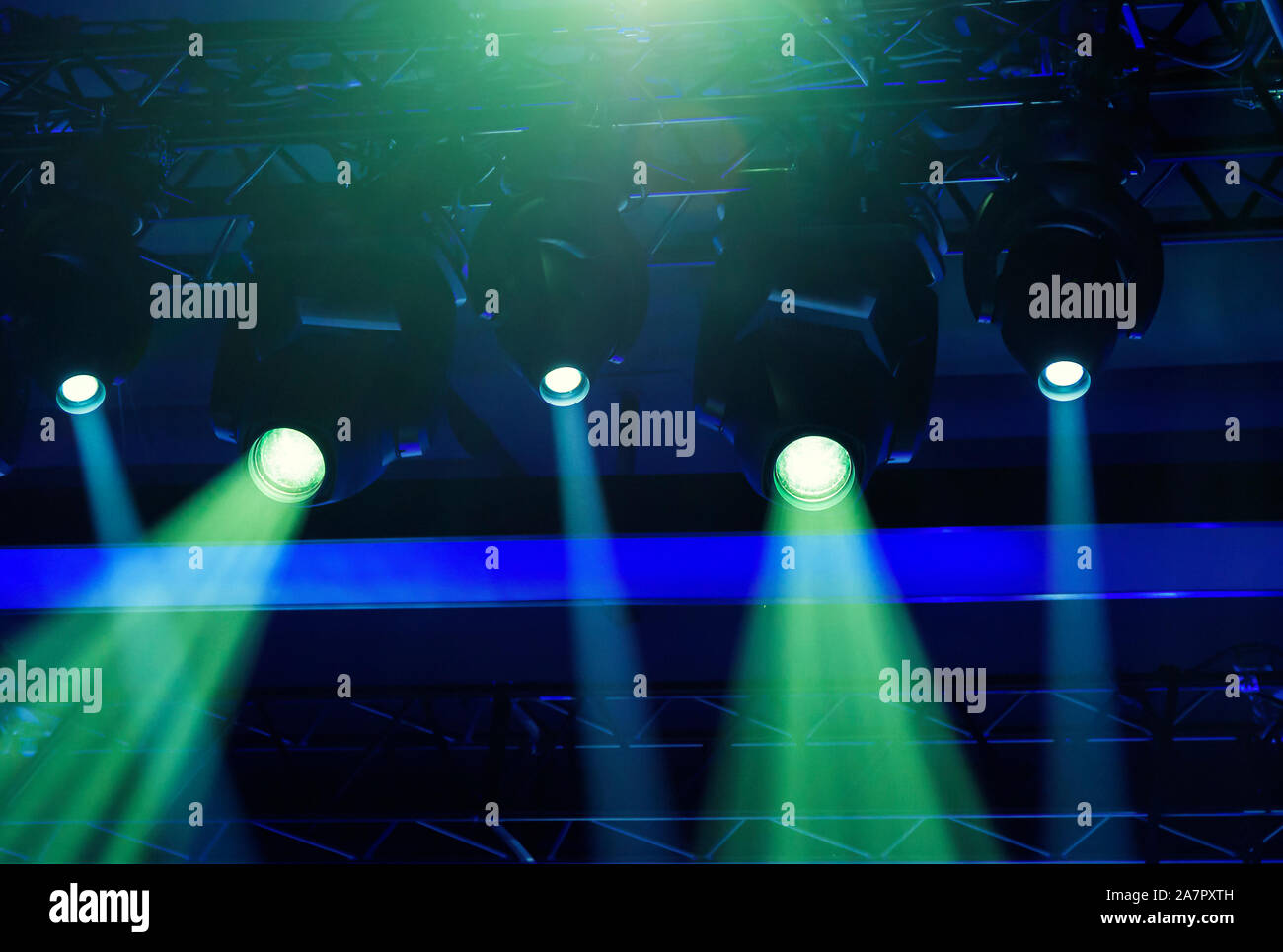 stage spotlights projecting lights during a live event. Live concerts and events Stock Photo