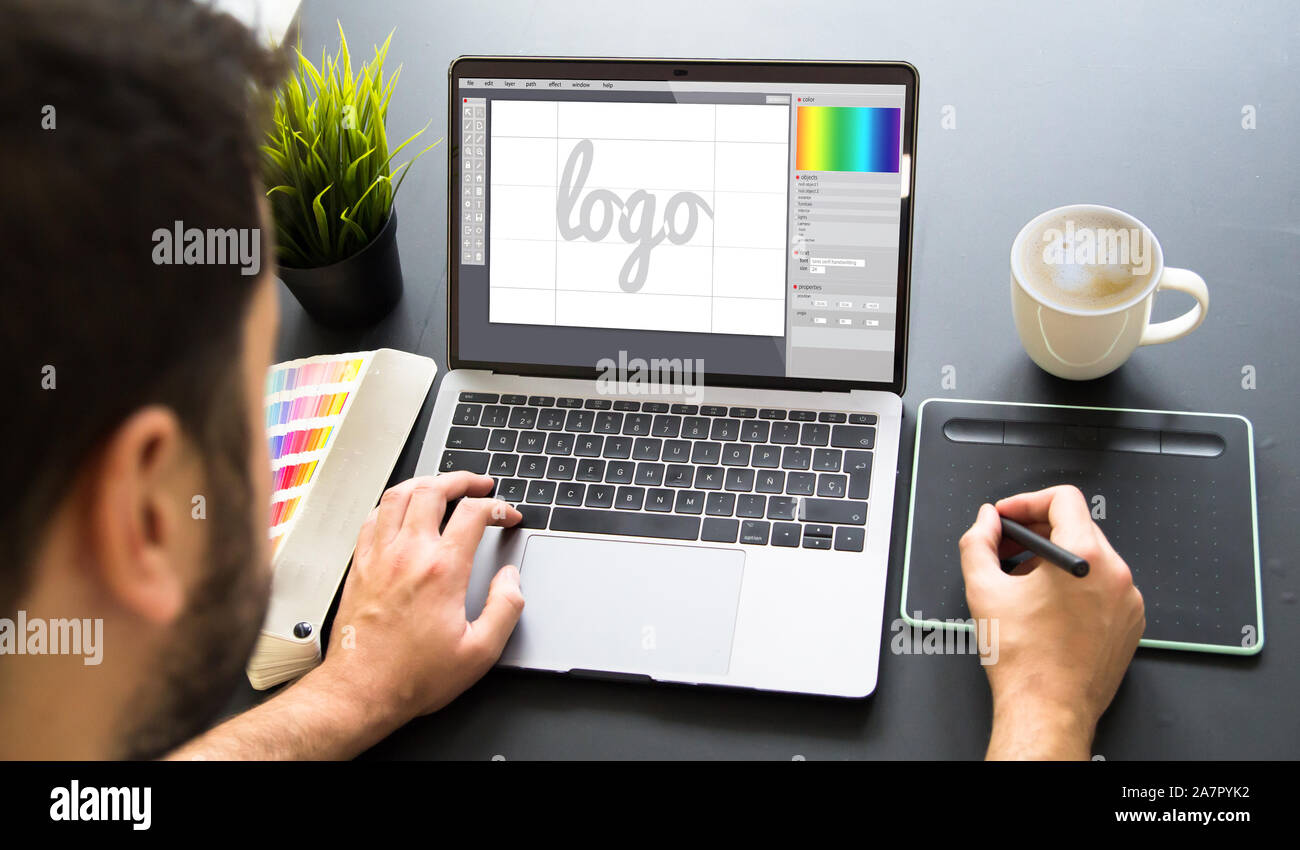 graphic designer working on laptop mock up Stock Photo