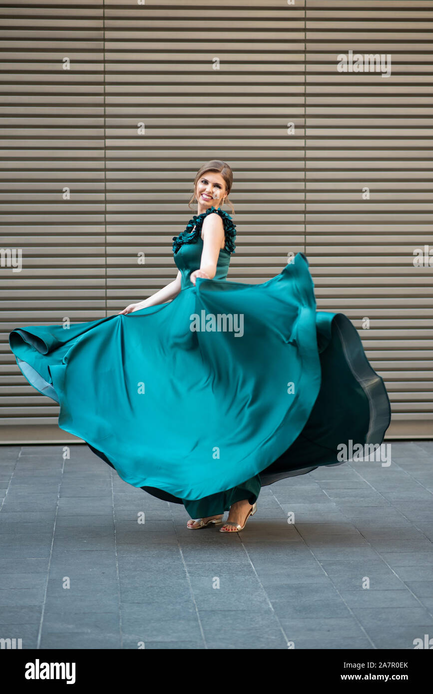 dancing on air dress green Happy woman in gree evening outdoors Stock Photo size-16