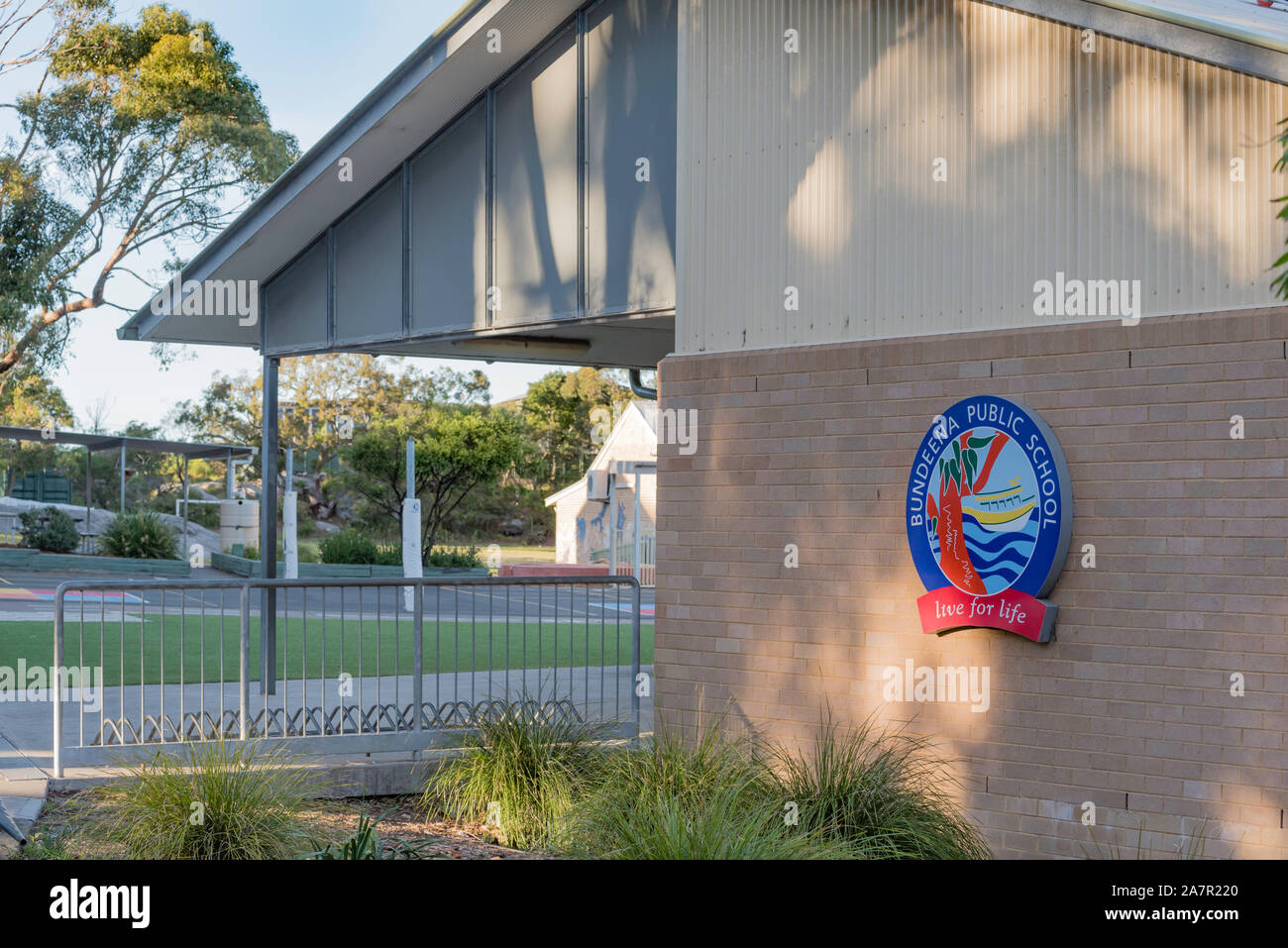 The school badge on the side of the assembly hall at Bundeena Primary, Public School in southern Sydney, Australia Stock Photo