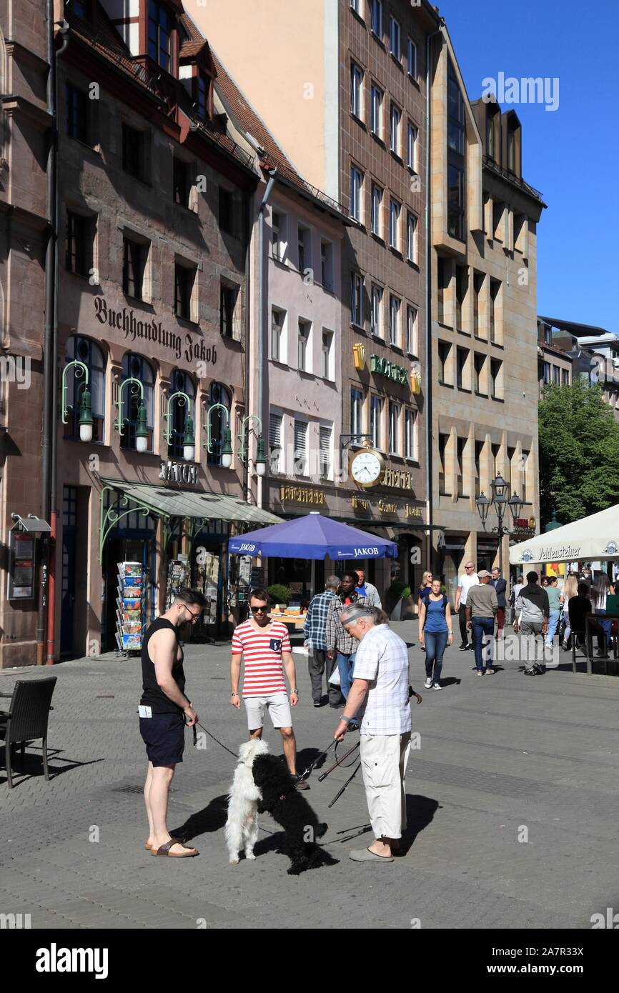 NUREMBERG, GERMANY - MAY 7, 2018: People visit Hefnersplatz (Hefner Square) shopping area in Nuremberg Old Town, Germany. Stock Photo