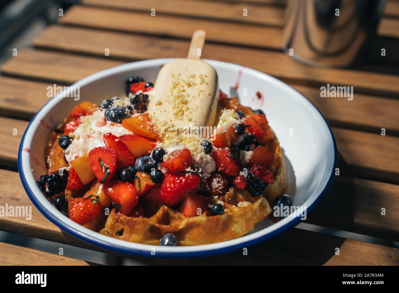 Delicious waffles with berry and ice cream Stock Photo - Alamy
