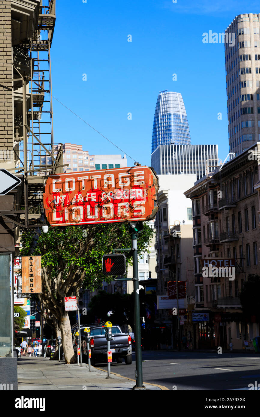 Old faded neon sign for Cottage Market Liquors on Bush St, San Francisco, California, United States of America Stock Photo