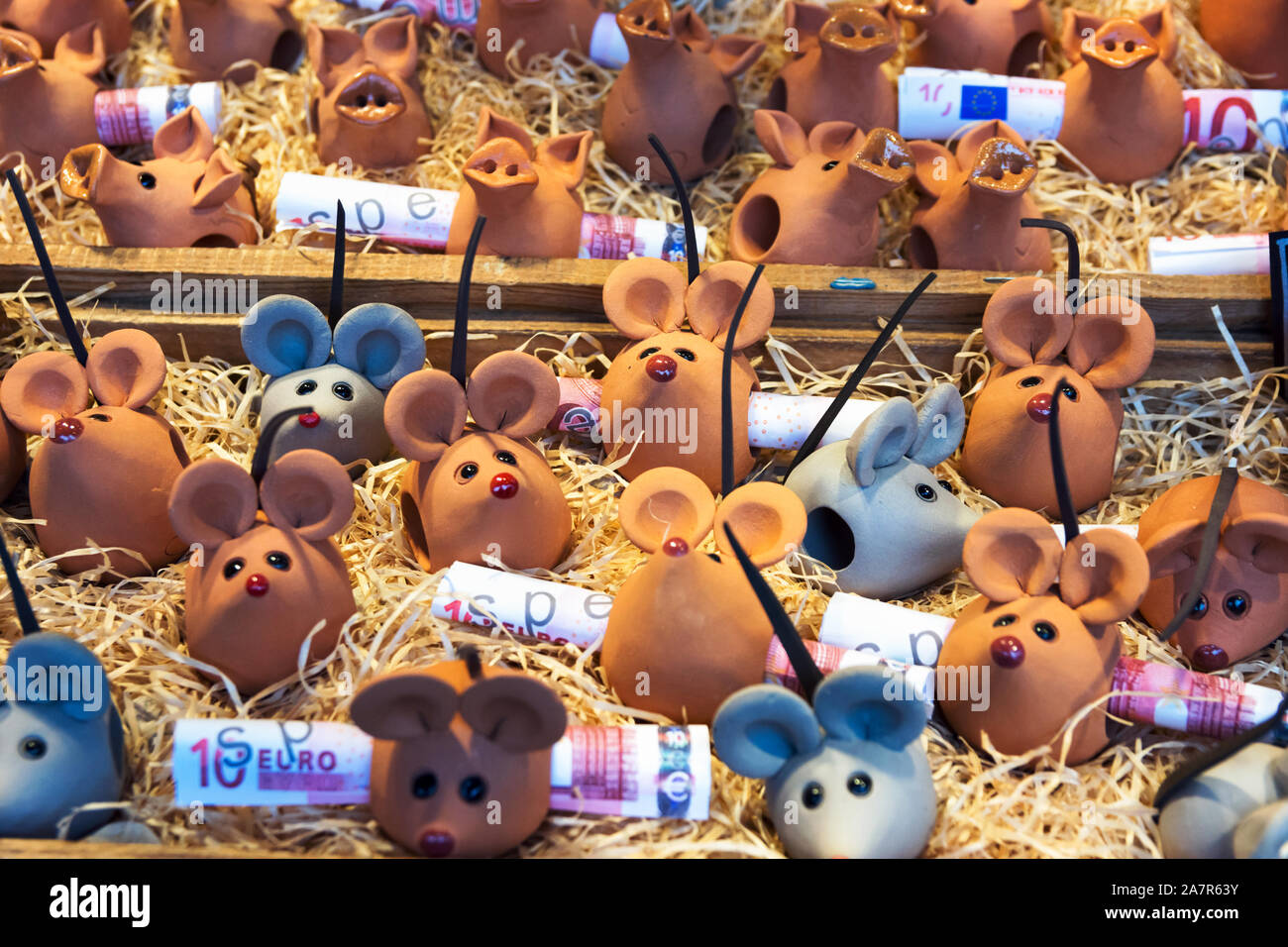Austria-Linz - December 6, 2018: Hand crafted artisan clay figures of rats mice with euro banknotes for sale at Christmas market Christkindlmarkt in E Stock Photo