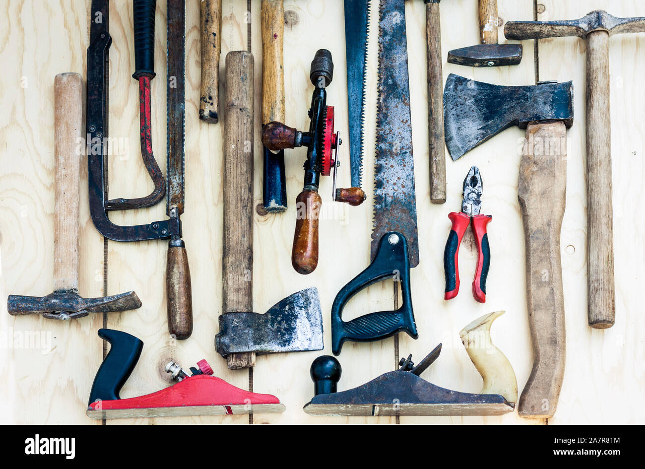 Set of vintage hand construction tools hammers on a wooden background