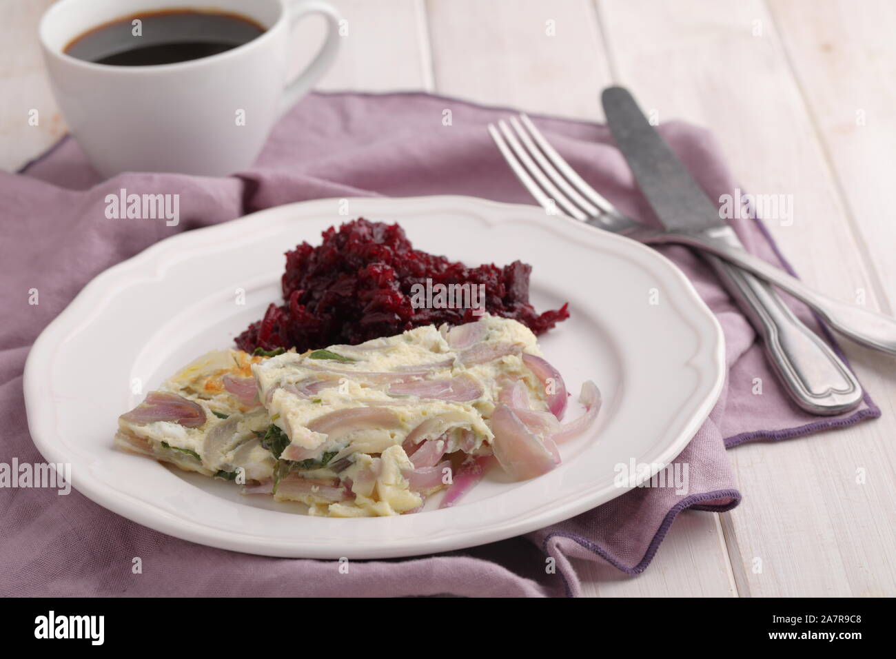 Omelet with red onion and beetroot salad. Healthy breakfast concept Stock Photo
