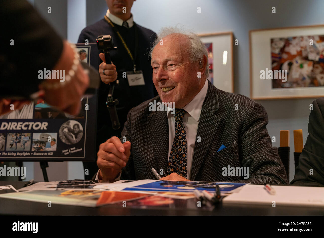 FRANKFURT AM MAIN, Germany - November 3rd 2019: John Glen (*1932, british film director an editor, most famous for directing a record five bond films) signing autographs for fans at 30 Years 'Licence to Kill' talk at Deutsches Filmmuseum DFF Stock Photo