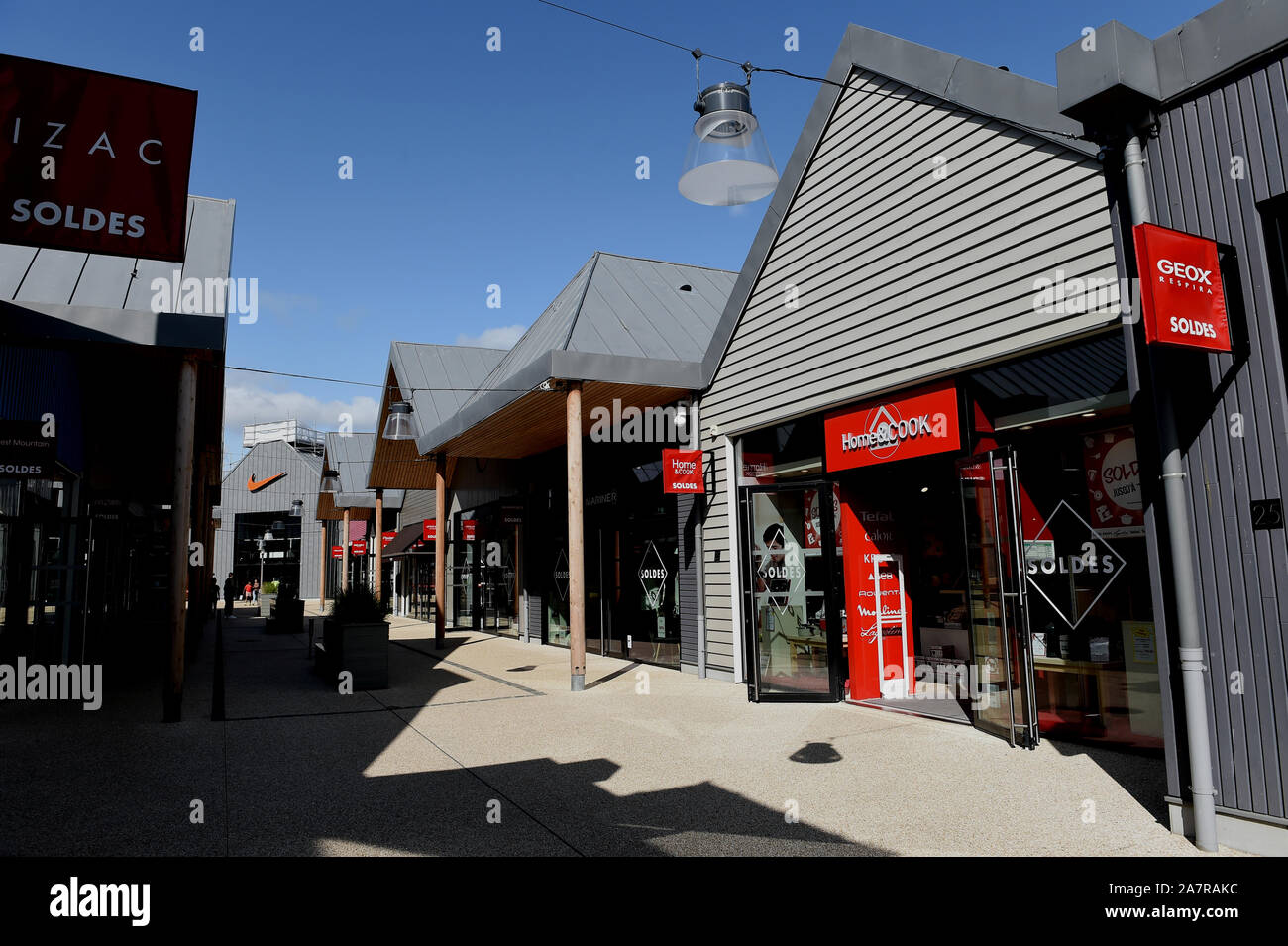 FILE--Customers shop at the designer outlets during the summer ...