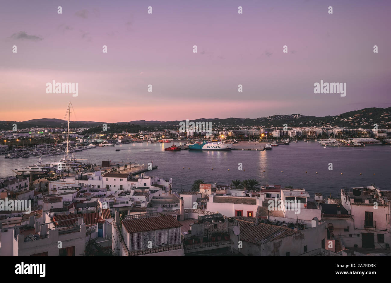 beautiful sunset in the historic area of Dalt Vila in Ibiza,Balearics,Spain.Cathedral and white houses in the wall area Stock Photo