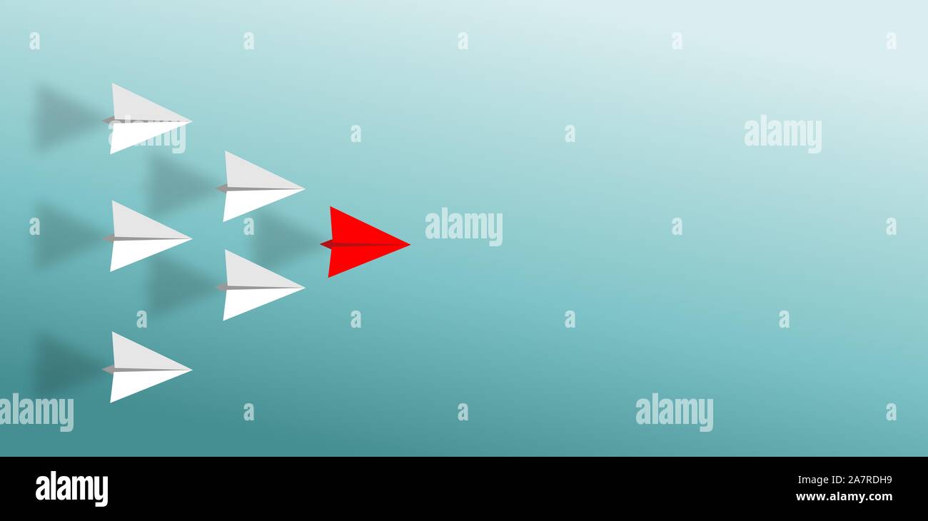 Group of white paper plane in one direction and one red paper plane ...