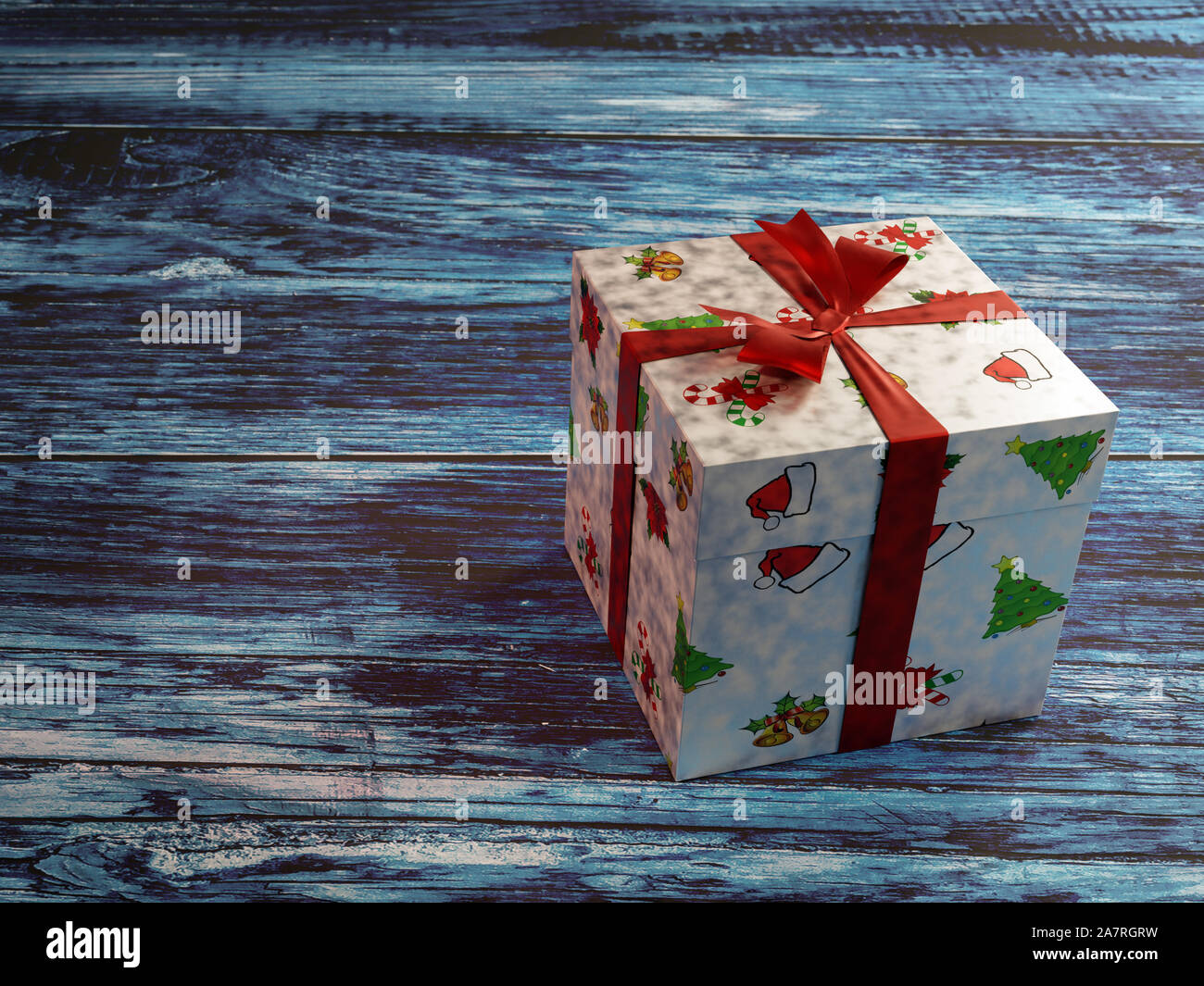 Christmas present box with red ribbon on rustic bluish wooden plank surface Stock Photo