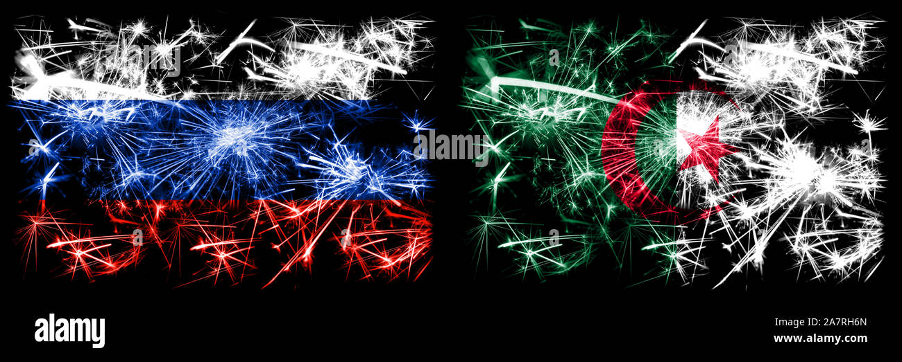 Russia, Russian vs Algeria, Algerian New Year celebration sparkling fireworks flags concept background. Combination of two states flags. Stock Photo