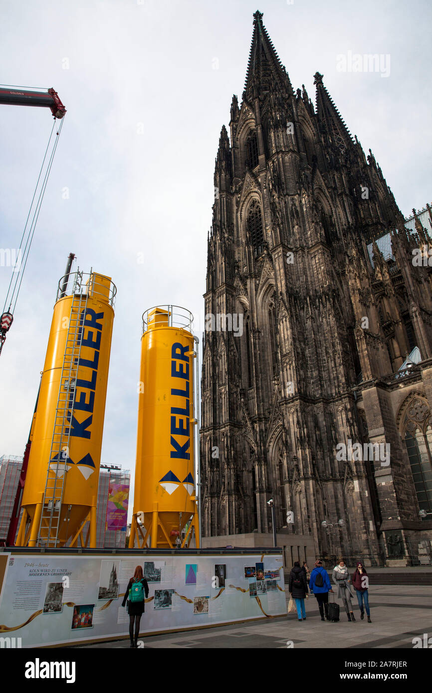 cement silos in front of the cathedral, Cologne, Germany.   Zementsilos vor dem Dom, Baustelle, Koeln, Deutschland. Stock Photo