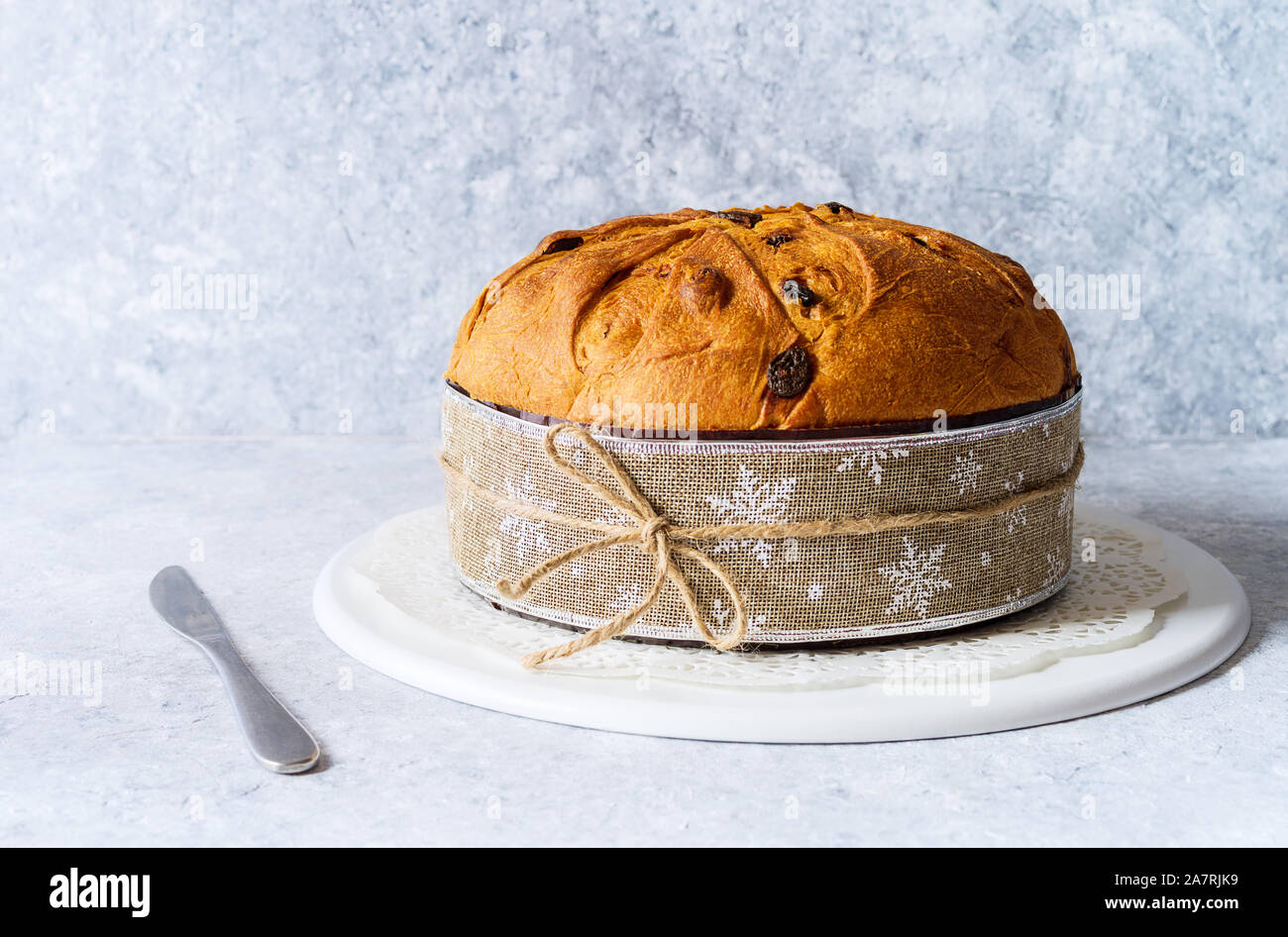 isolated panettone, typical christmas italian food, on rustic delocate background. Stock Photo