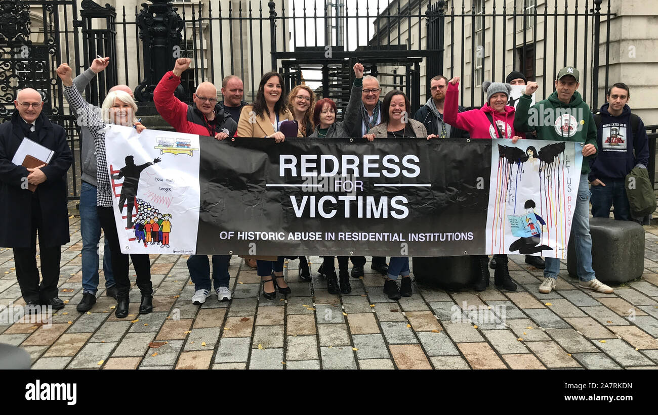 Survivors of historical institutional abuse celebrating outside The Court of Appeal in Northern Ireland, as it has ruled that the Executive Office has the power to introduce a compensation scheme for victims of historical institutional abuse. Stock Photo