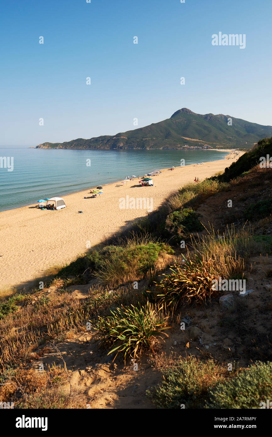 The sandy beach and blue sea coastline of Costa Verde near Buggerru looking north to Capo Pecora in south east Sardinia Italy Europe. Stock Photo