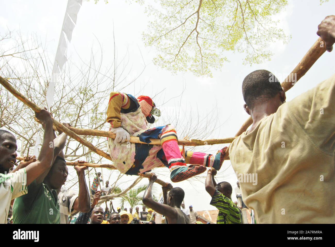 Masqueraders uplifting the Egungun Masquerade during their performance at the Annual Black Heritage Festival. Badagry Lagos, Nigeria. Stock Photo