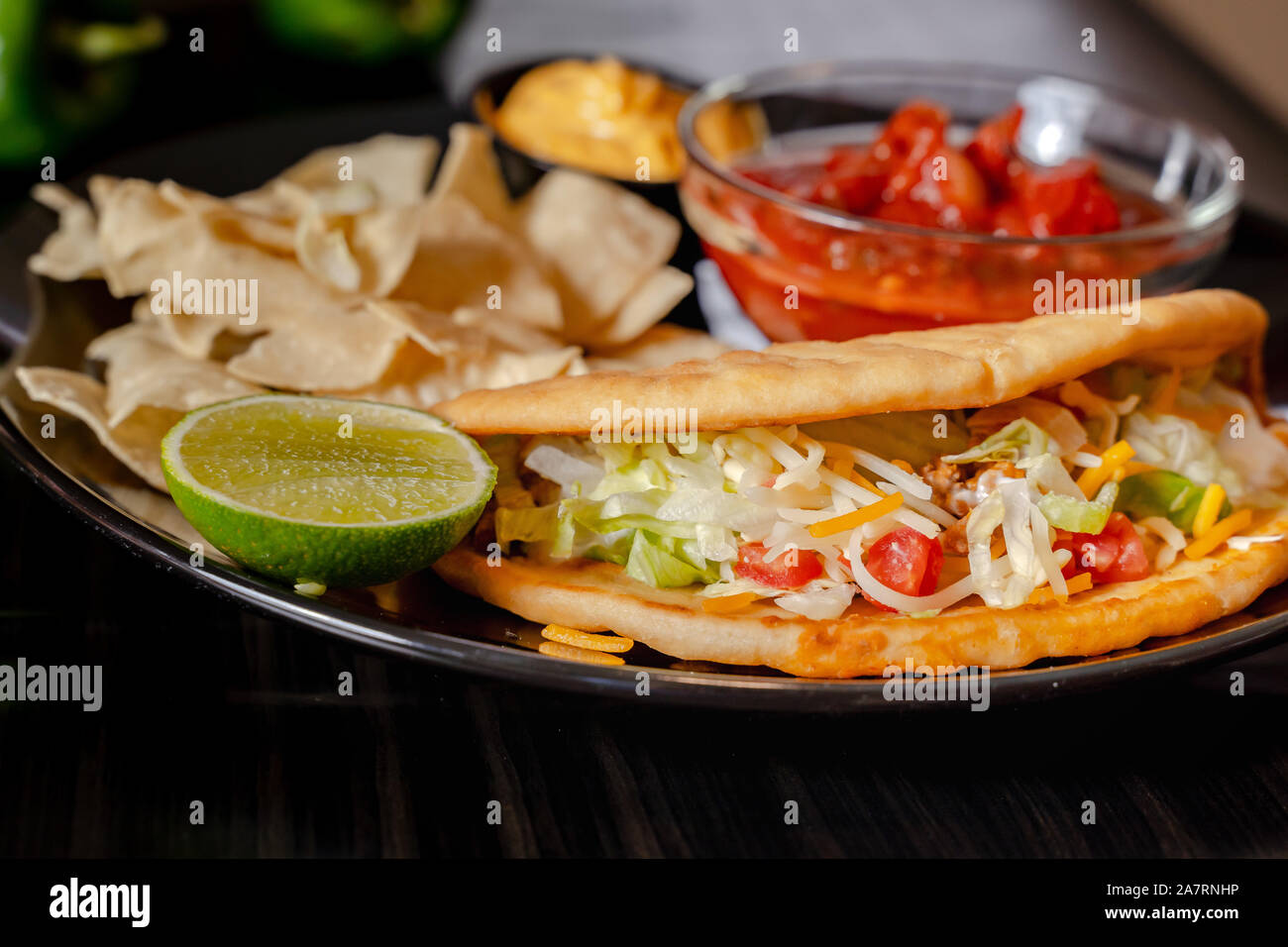 Homemade Baja Fish Tacos with Mango Salsa and Chips. Mixed mexican food ...